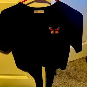 A beautiful top with butterfly on it